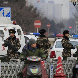 La Chine adopte une loi antiterroriste. [key - AP Photo/Andy Wong]