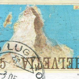 Un timbre représentant le Cervin en surimpression d'une carte inversée de l'Afrique.
rook76
Fotolia [rook76]