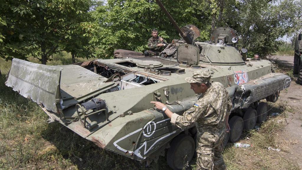 Des soldats ukrainiens dans l'est de l'Ukraine. [EPA/Keystone - Sergey Vaganov]