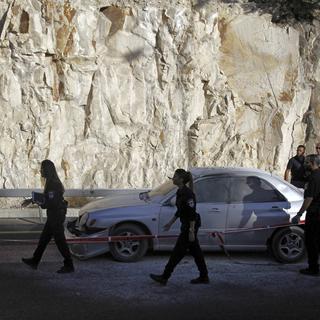Une Palestinienne a fait exploser une charge dans sa voiture lors d’un contrôle policier près de Jérusalem. [AP Photo/Keystone - Mahmoud Illean]