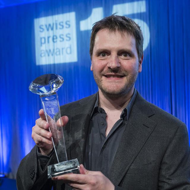 Yvain Genevay lors de la remise du prix "Photographe de presse suisse de lʹannée", le 15 avril 2015 à Berne. [Alessandro della Valle]