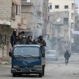 Attaques et intenses combats entre les forces d'opposition et du régime se succèdent en Syrie. [AFP - Ahmad Aboud]
