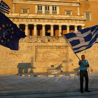 La Grèce et ses créanciers sont parvenus à un accord sur les objectifs budgétaires du pays entre cette année et 2018, a indiqué dans la nuit de lundi à mardi une source gouvernementale à Athènes. [AP/Keystone - Petros Karadjias]