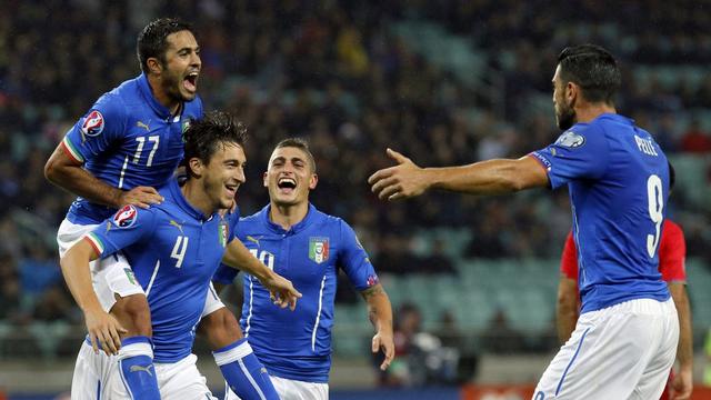 Les Italiens célèbrent le but du 3-1, inscrit par Darmian (no4). [Zurab Kurtsikidze]