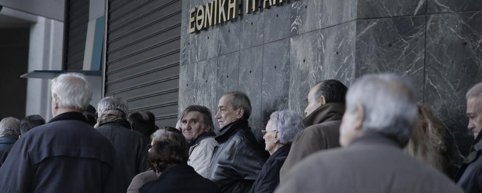 Les Grecs retirent dans le calme leur argent. [key - AP Photo/Petros Giannakouris]