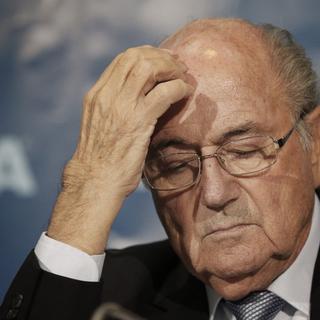La commission d'éthique de la FIFA a suspendu pour huit ans Sepp Blatter et Michel Platini de toute activité liée au football. [Keystone]