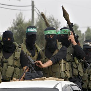 Les brigades Ezzedine al-Qassam, la branche armée du Hamas palestinien, au pouvoir dans la bande de Gaza. [Keystone - AP Photo/Adel Hana]