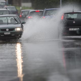 Des pluies abondantes sont attendues sur tout le pays, comme ici en juillet 2014 à Hinwil. [Keystone - Ennio Leanza]