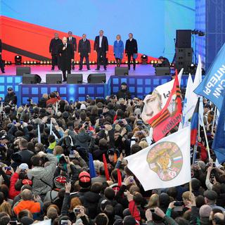 La Russie célèbre l’anniversaire du rattachement de la Crimée. [Keystone - EPA / MIKHAIL KLIMENTYEV / RIA NOVOSTI / KREMLIN POOL]
