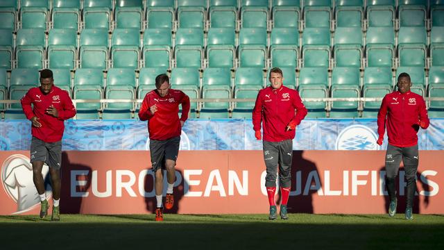 Johan Djourou, Jospi Drmic, Granit Xhaka et Breel Embolo connaîtront leurs adversaires le 12 décembre. [Keystone - Georgios Kefalas]