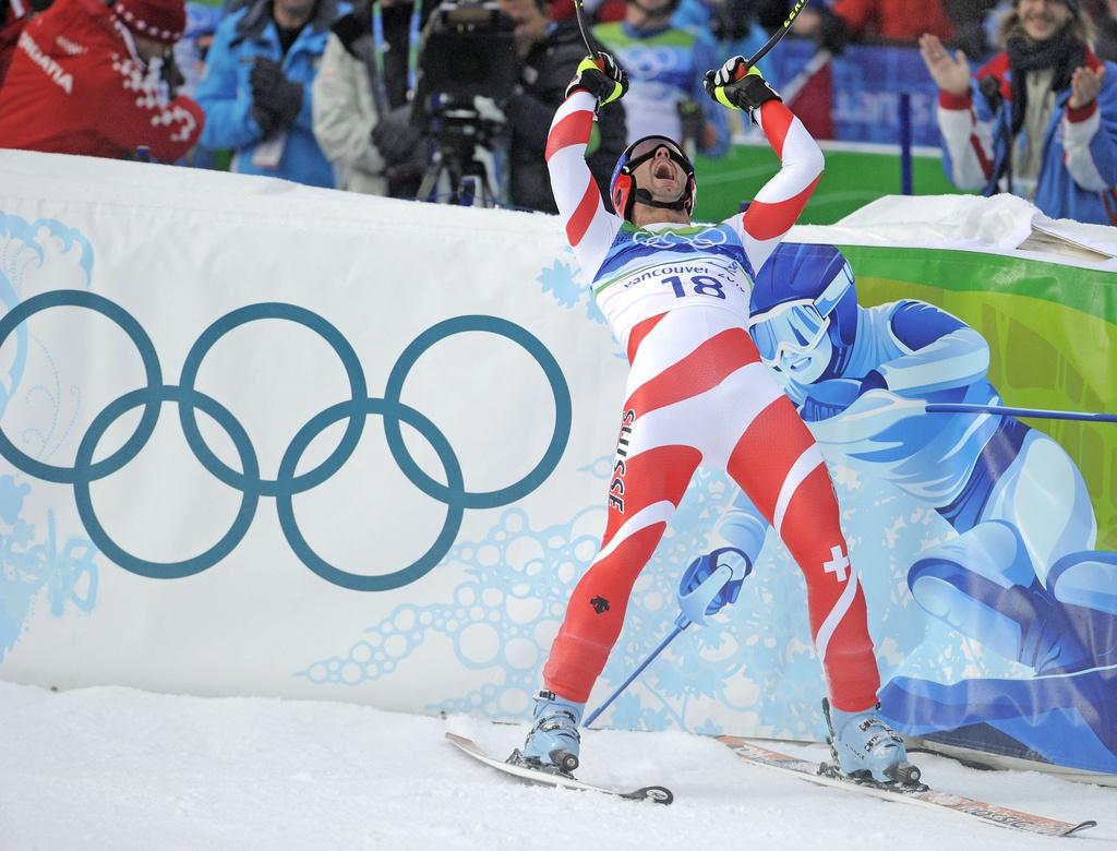15 février 2010: Le Morginois champion olympique de descente, comme les illustres Zurbriggen (1988) et Russi (1972). [KEYSTONE - Gero Breloer]