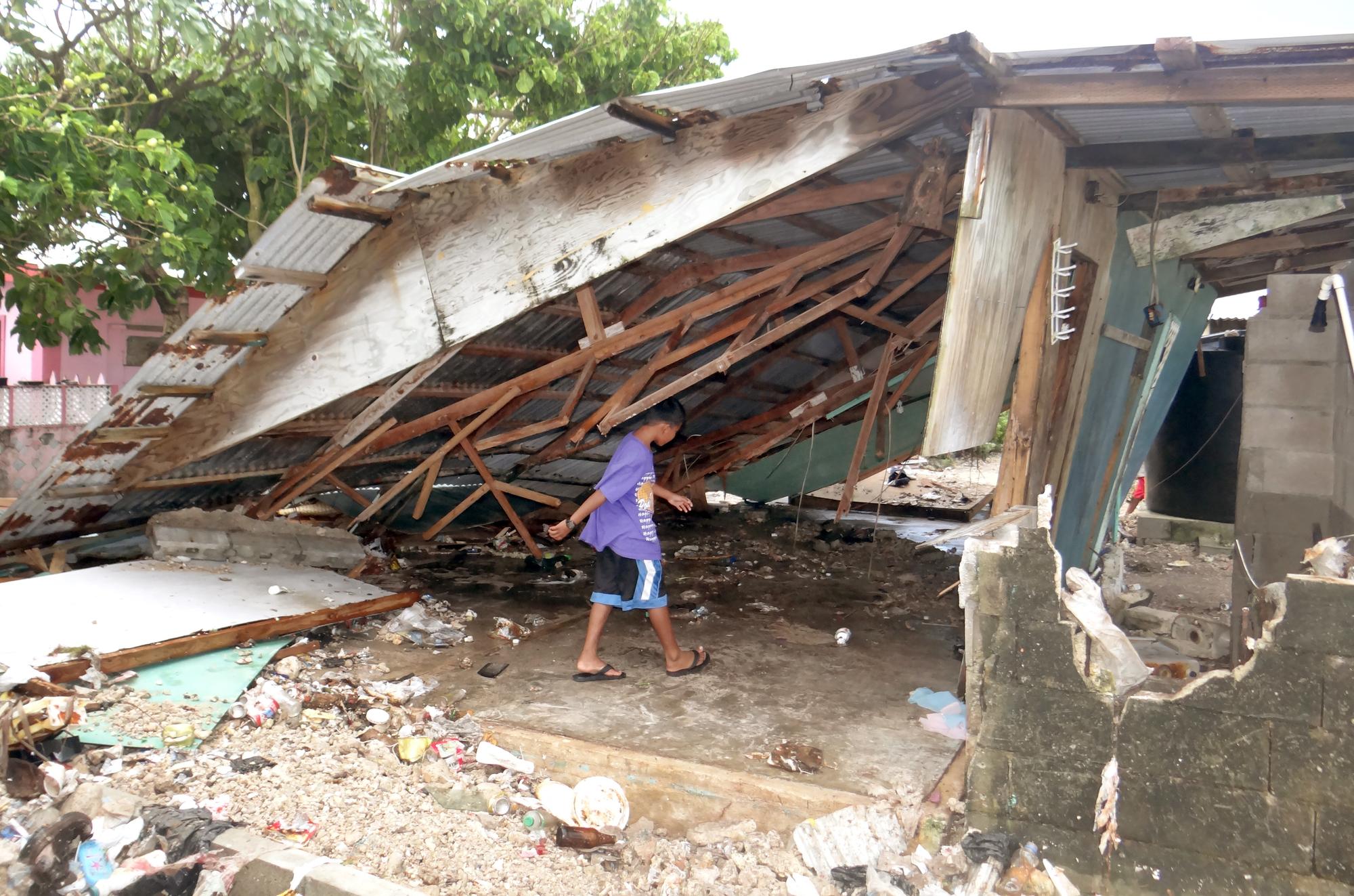 Maison détruite par une tempête dans les îles Marshall en mars 2014. [AFP - Giff Johnson]