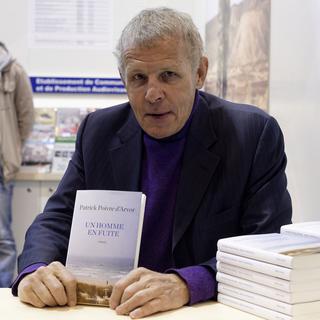 Patrick Poivre d'Arvor présente son livre "Un homme en fuite" au Salon du Livre de Paris le 20 mars 2015. [AFP - Lionel Bonaventure]