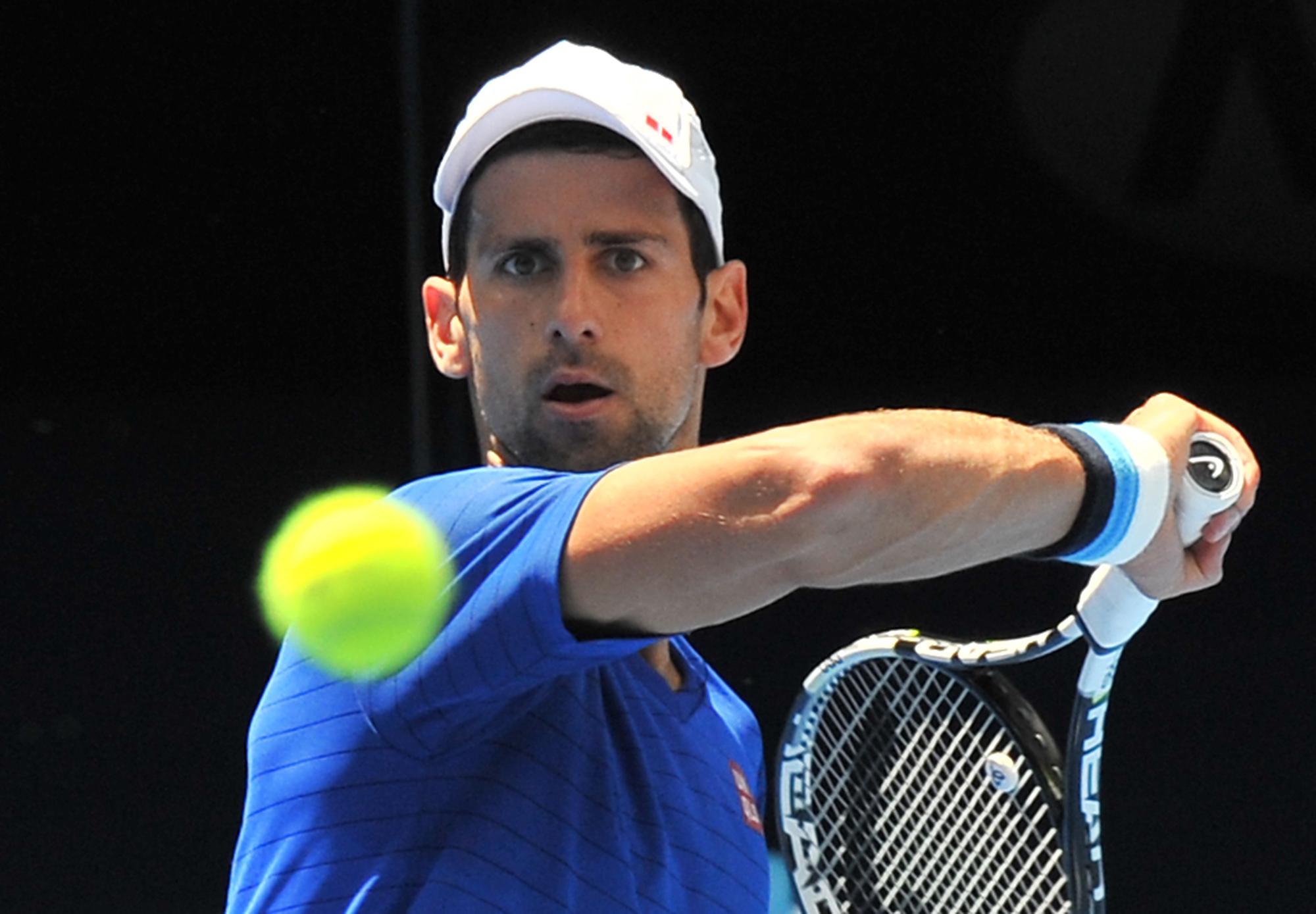 Djokovic vise un 5e titre à Melbourne, comme Federer. [AFP - PAUL CROCK]