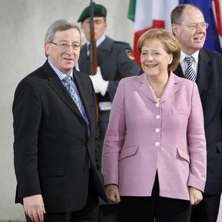Angela Merkel et Jean-Claude Junker doivent se rencontrer à nouveau. [AP/Keystone - Michael Sohn]