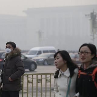 A Pékin, la ville est fréquemment prise dans un épais smog. [EPA/Keystone - Rolex dela Pena]
