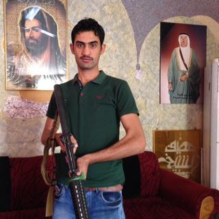 Un milicien chiite dans le quartier de al-Hadar à Bagdad. [RTS - Alexandre Habbay]