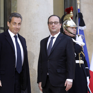 François Hollande a reçu ce jeudi matin le président de l'UMP Nicolas Sarkozy à l'Elysée. [AP/Keystone]