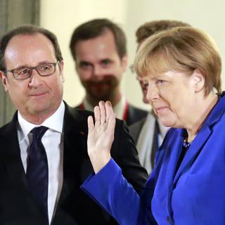 François Hollande et Angela Merkel. [AP/Keystone - Jacques Brinon]