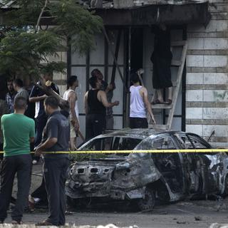 Cinq voitures ont explosé ce dimanche dans différents quartiers de la ville de Gaza. [AFP - Mohammed Abed]