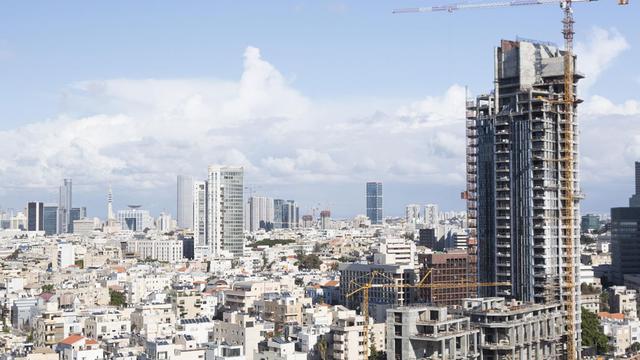 Israël fait venir 20'000 travailleurs chinois pour remplir ses besoins de main-d’œuvre qualifiée dans la construction. [DPA/AFP - Robert B. Fishman]