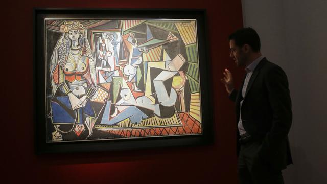 La toile de Picasso "Les Femmes d'Alger (version O)" exposée chesz Christie's à New York, 01.05.2015. [AFP - Eduardo Munoz Alvarez]