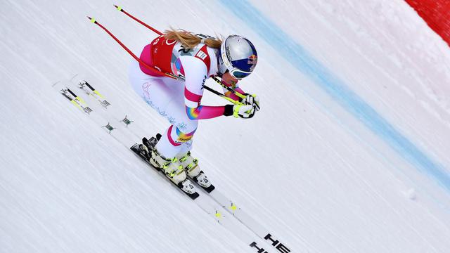 18 janvier, Cortina d'Ampezzo: Lindsey Vonn entre dans la légende! L'Américaine enlève la descente et égale le record du nombre de victoires de l'Autrichienne Annemarie Moser-Pröll en Coupe du monde (62). [Florian Ertl]