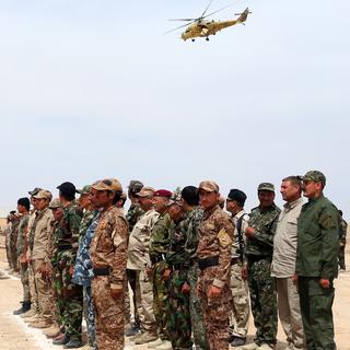 Des combattants sunnites intronisés au sein d'une force paramilitaire irakienne. [Hadi Mizban - AP Photo/Keystone]