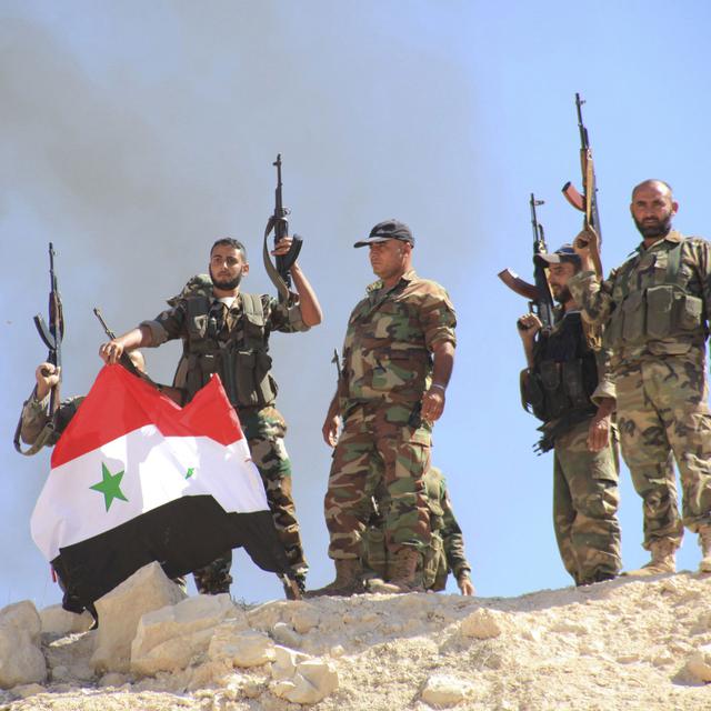 Des forces du président Bashar al-Assad dans la région de Hama en Syrie en octobre 2014. [Reuters - George Ourfalian]