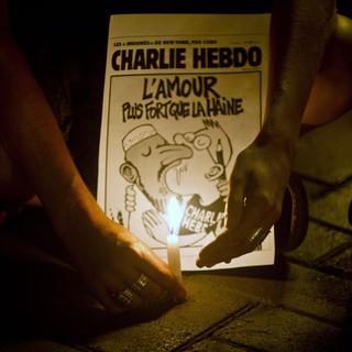 En mémoire aux victimes de l'attaque de Charlie Hebod, manifestation le 7 janvier 2015 à Lima au Pérou. [AFP - Ernesto Benavides]