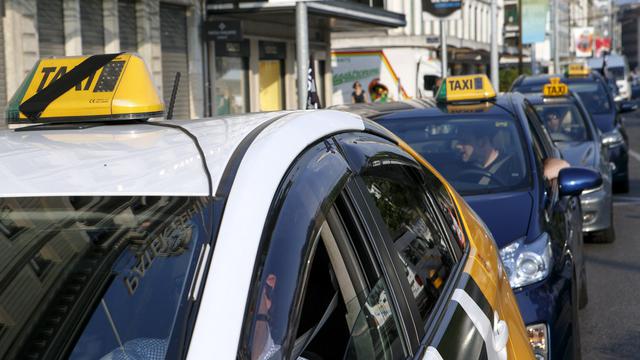 Les taxis genevois ont déjà protesté plusieurs fois, comme ici en juillet 2015. [Keystone - Salvatore Di Nolfi]