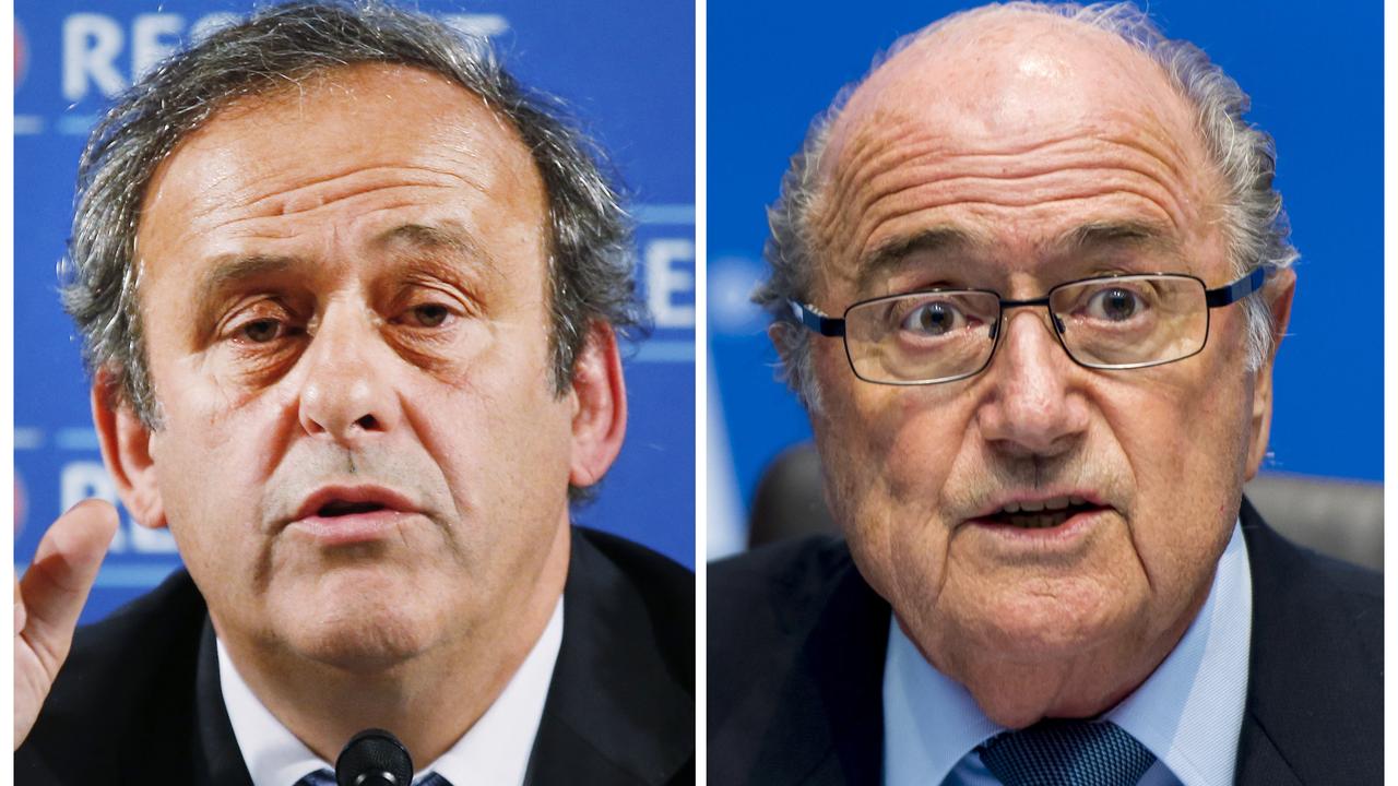 Platini et Blatter sont toujours dans l'expectative. [AFP - Fabrice Coffrini]