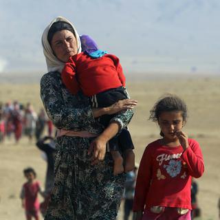 11 août 2014, Sinjar (Irak). Des membres de la minorité Yazidi fuient les violences de l'Etat islamique en direction de la frontière syrienne. [Rodi Said]