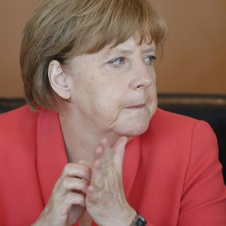 Certains médias et internautes voulaient voir la preuve de l'insensibilité de la chancelière allemande. [Reuters - Fabrizio Bensch]
