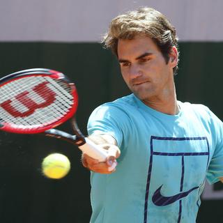 Roger Federer lors d'une session d'entraînement, le 23 mai. [AFP - Patrick Kovarik]