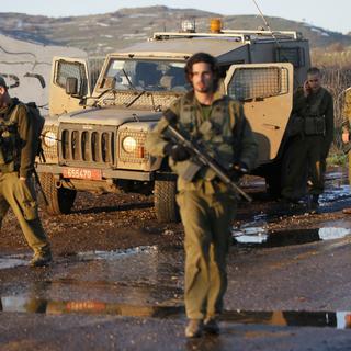 Des troupes israéliennes patrouillent dans un secteur occupé du Golan. [AFP - Jalaa Marey]