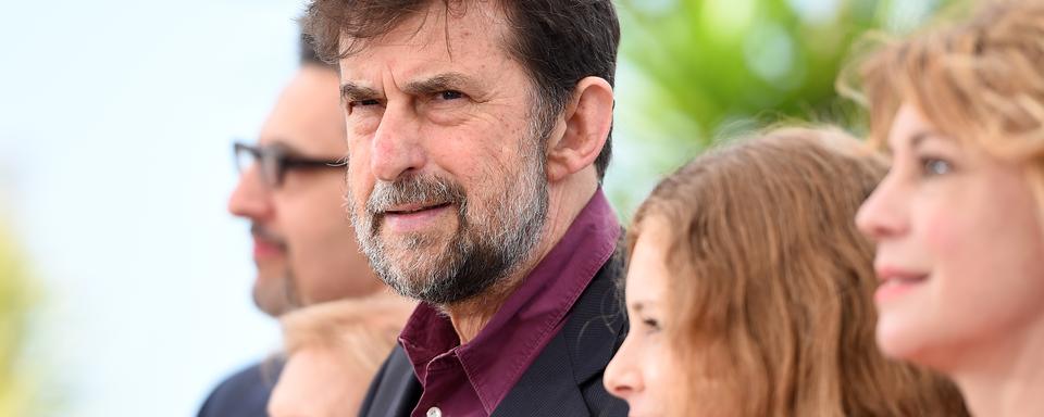 Habitué de Cannes, Nanni Moretti pose avec l'équipe de "Mia Madre" au 68ème Festival de Cannes. [AFP - Anne-Christine Poujoulat]