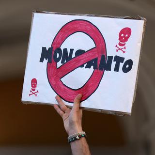 Une bannière anti-Monsanto. [AP Photo / Keystone - Armando Franca]
