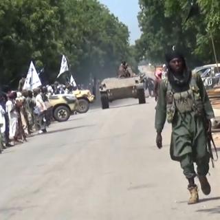 Défilé du groupe djihadiste nigérian Boko Haram. [AFP - HO/Boko Haram vidéo]