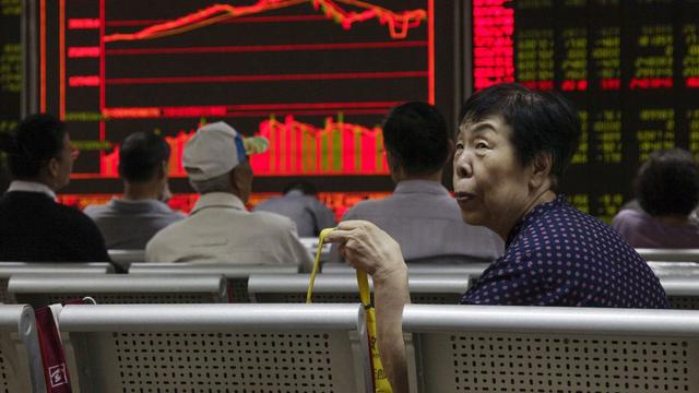 Les marchés boursiers chinois ont finalement terminé en hausse après une nouvelle injection de fonds de la banque centrale. [EPA/Keystone - Rolex dela Pena]