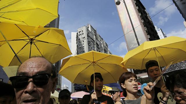 Mercredi 1er juillet: manifestants lors du défilé annuel pro-démocratie à Hong Kong. [AP/Keystone - Vincent Yu]