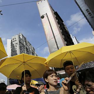 Mercredi 1er juillet: manifestants lors du défilé annuel pro-démocratie à Hong Kong. [AP/Keystone - Vincent Yu]