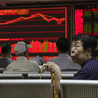 Les marchés boursiers chinois ont finalement terminé en hausse après une nouvelle injection de fonds de la banque centrale. [EPA/Keystone - Rolex dela Pena]