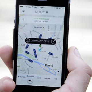 Uber a décidé de suspendre immédiatement UberPOP en France. [AFP - Thomas Oliva]