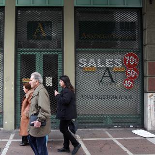 Pour les petits commerçants l’absence de liquidité représente un risque important. [Keystone - Thanassis Stavrakis - AP Photo]