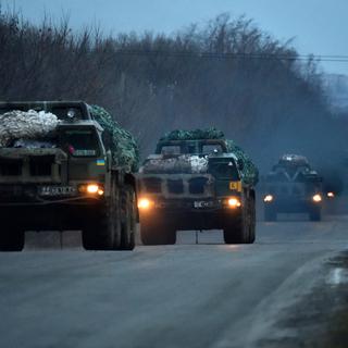 Convoi ukrainien dans la région de Kramatorsk, 06.03.2015. [AFP - Serguei Supinsky]