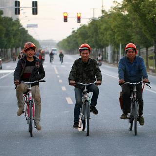 Travailleurs migrants à Shanghai. [Imaginechina/AFP - Li zhuoxiang]