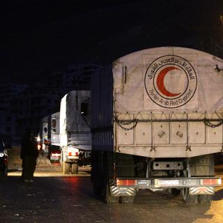 Une quarantaine de camions étaient arrivés jeudi soir dans la ville de Madaya. [AFP]