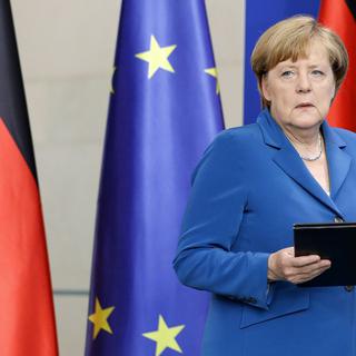 La politique migratoire d'Angela Merkel fait débat. [AP/Keystone - Michael Sohn]