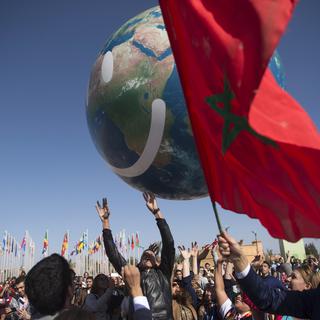 Les négociateurs ont mis un point final à Marrakech à la 22e conférence de l'ONU sur le climat, le vendredi 18 novembre 2016. [AFP - FADEL SENNA]